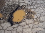 A close up of Pot Hole Repair