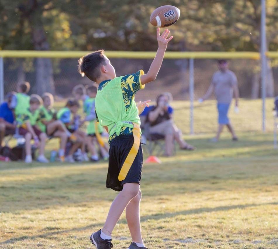 A child throwing a football
