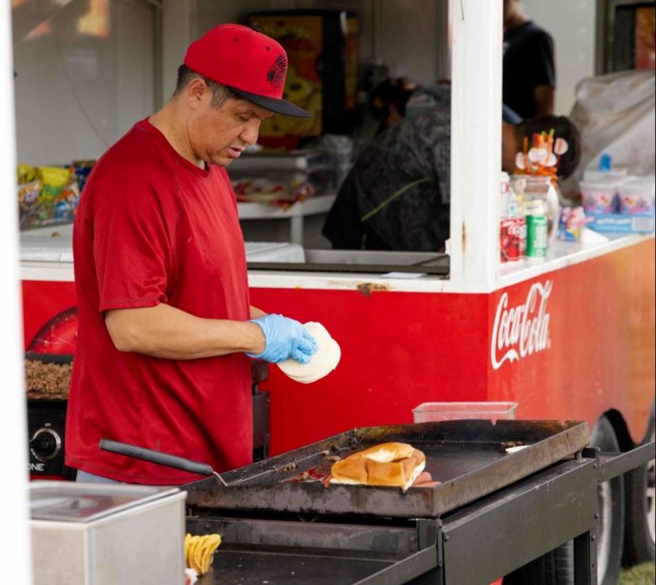 A person cooking on a grill