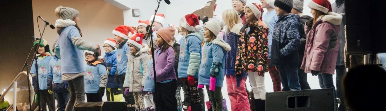 children singing on a stage